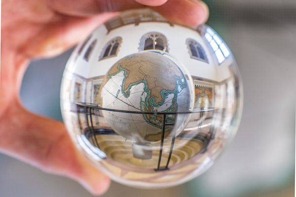 Globe reflected in a polished glass ball